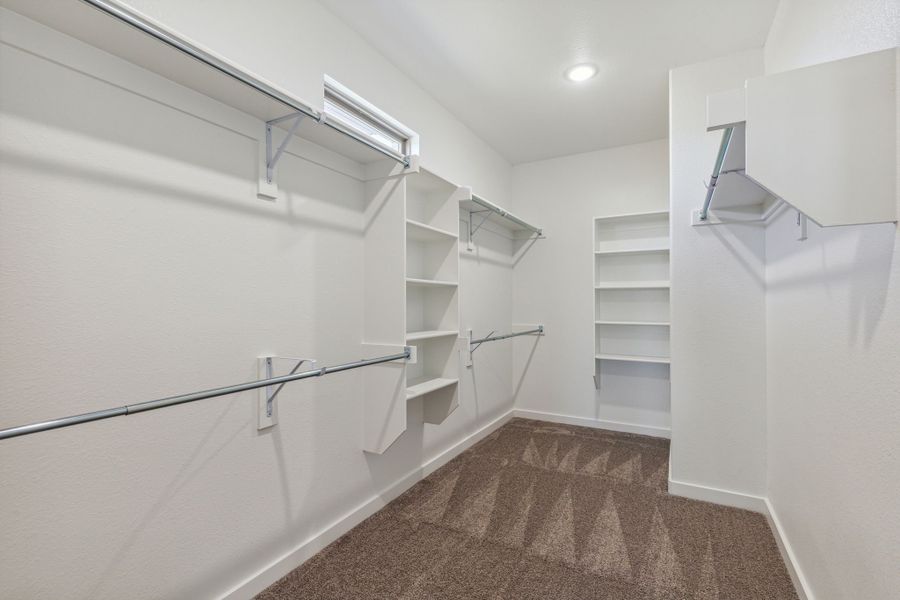 Primary Closet in the Willow home plan by Trophy Signature Homes – REPRESENTATIVE PHOTO