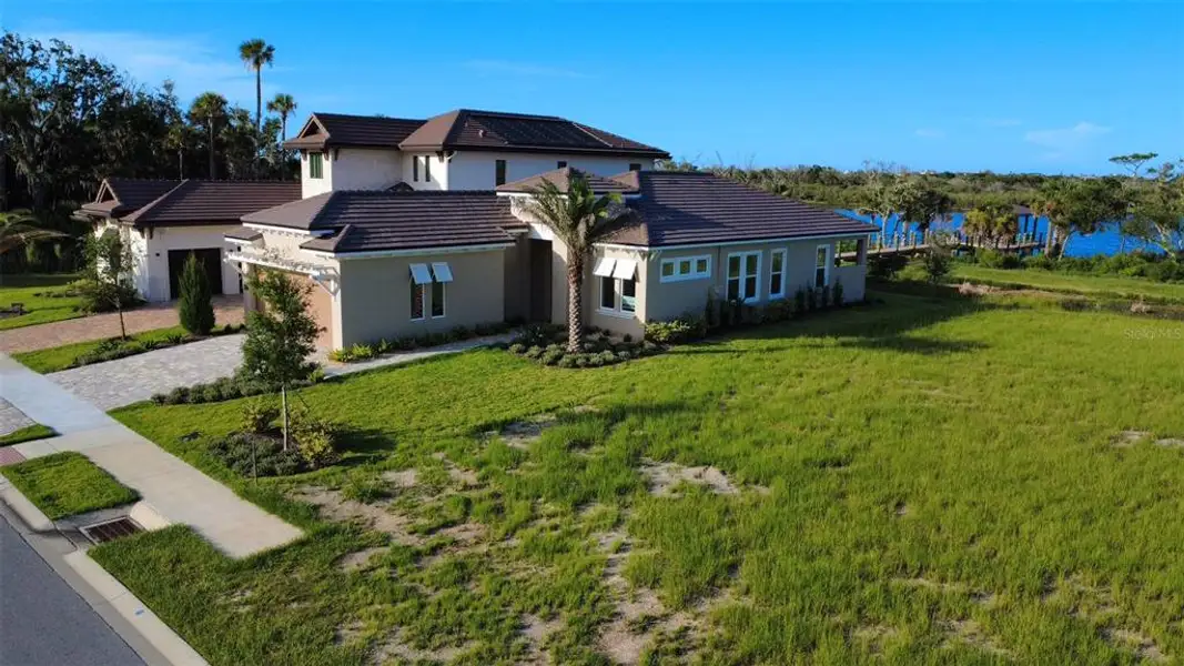 Front exterior of a new home in , Flagler Beach, FL, highlighting curb appeal (Image 1). Front exterior of a new home in , Flagler Beach, FL, highlighting curb appeal (Image 1).