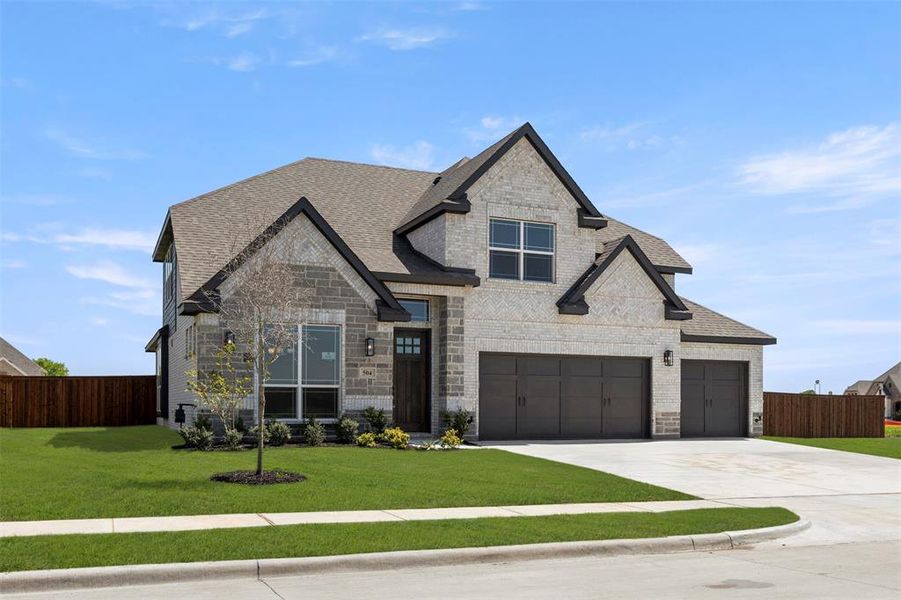 Front exterior of a new home in Lovers Landing, Forney, TX, highlighting curb appeal (Image 18). Front exterior of a new home in Lovers Landing, Forney, TX, highlighting curb appeal (Image 18).
