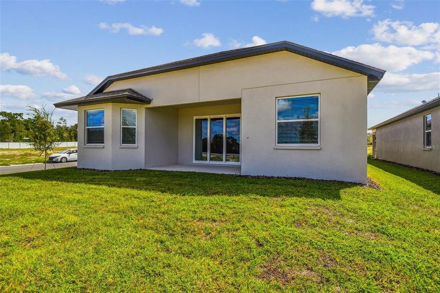 Front exterior of a new home in Pinecone Reserve, Brooksville, FL, highlighting curb appeal (Image 1). Front exterior of a new home in Pinecone Reserve, Brooksville, FL, highlighting curb appeal (Image 1).