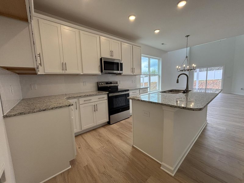 Furnished interior view inside a new home in CraigStone, Woodruff (Image 4).