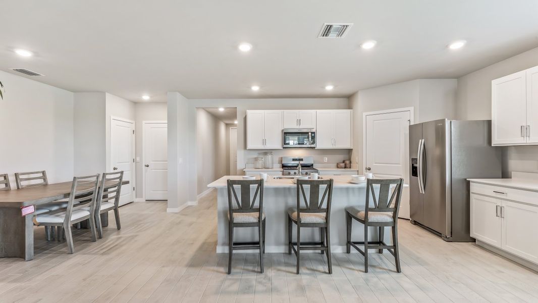 Furnished interior view inside a new home in Palmetto Landing at Babcock Ranch - Express, Punta Gorda (Image 5). Furnished interior view inside a new home in Palmetto Landing at Babcock Ranch - Express, Punta Gorda (Image 5).