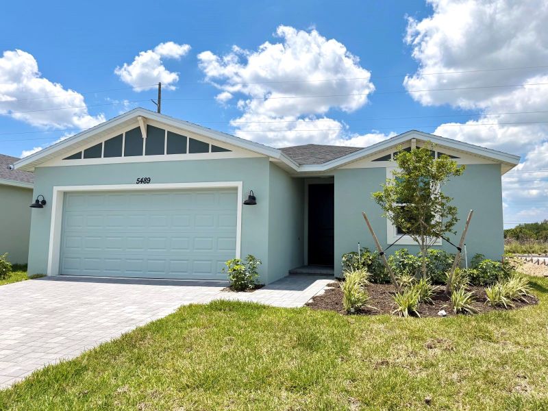 Front exterior of a new home in Hampton Park - Classic Series, Vero Beach, FL, highlighting curb appeal (Image 2). Front exterior of a new home in Hampton Park - Classic Series, Vero Beach, FL, highlighting curb appeal (Image 2).