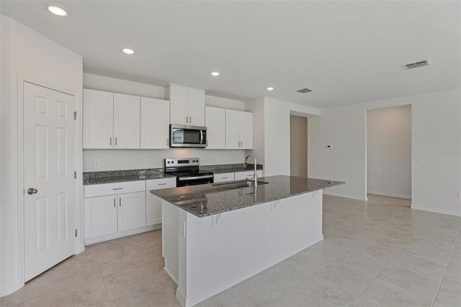 Furnished interior view inside a new home in Lawson Dunes - Signature Series, Haines City (Image 4). Furnished interior view inside a new home in Lawson Dunes - Signature Series, Haines City (Image 4).