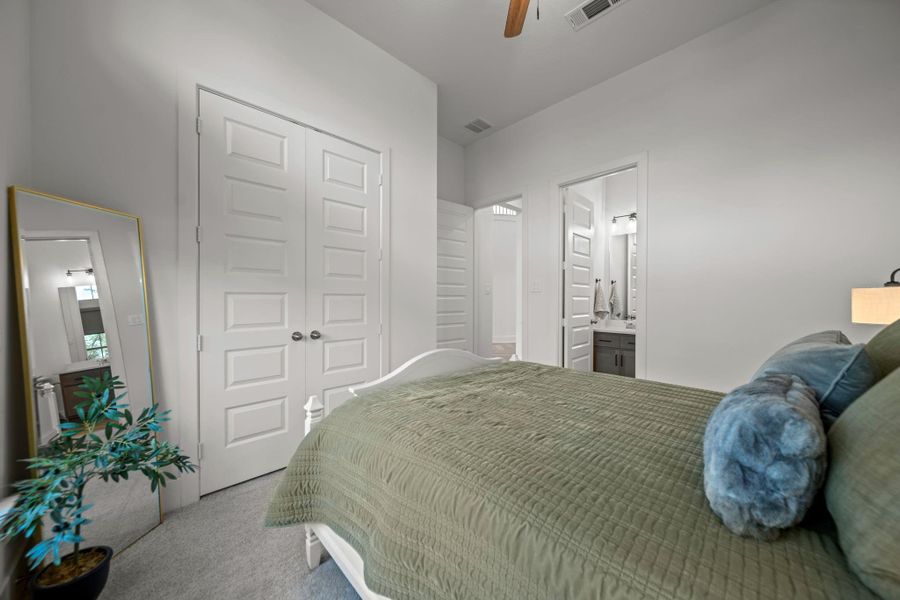 Secondary suite includes its own bath access and double-door closet, offering privacy and convenience. Secondary suite includes its own bath access and double-door closet, offering privacy and convenience.
