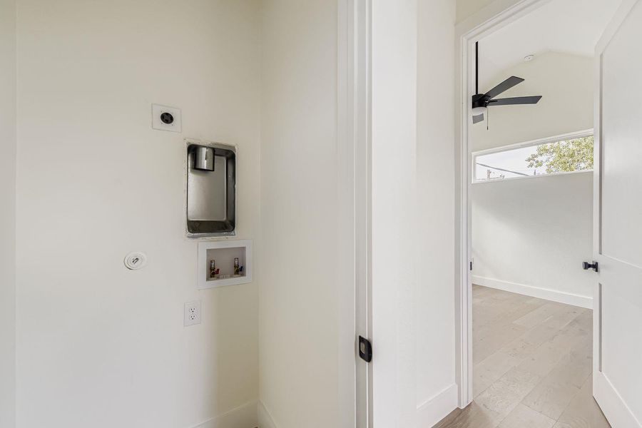 Washroom featuring light wood-type flooring, hookup for a washing machine, a ceiling fan, and hookup for an electric dryer Washroom featuring light wood-type flooring, hookup for a washing machine, a ceiling fan, and hookup for an electric dryer