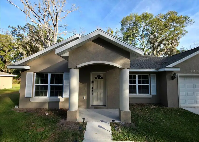 Front exterior of a new home in , Summerfield, FL, highlighting curb appeal (Image 2). Front exterior of a new home in , Summerfield, FL, highlighting curb appeal (Image 2).