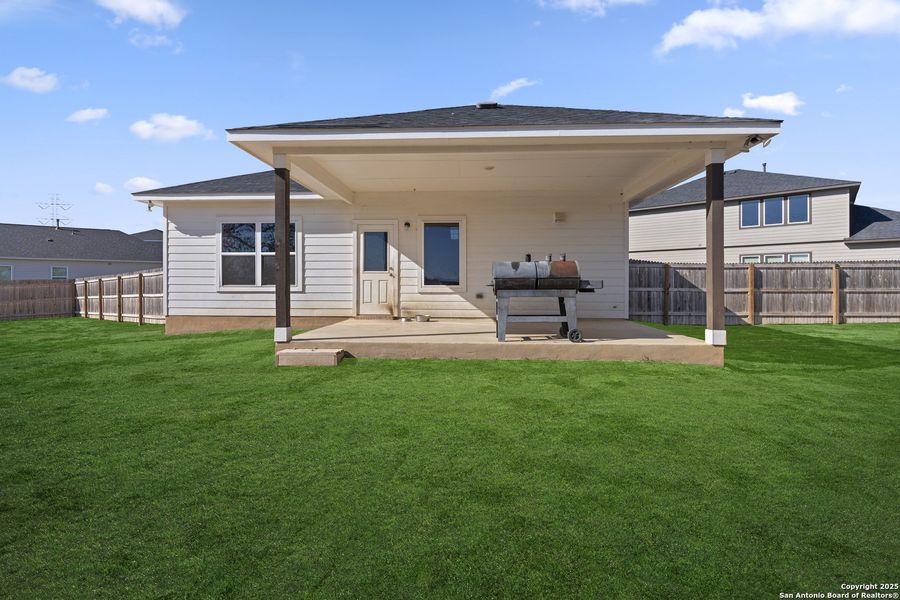 Exterior details and patio area of a home in Hickory Ridge, Elmendorf (Image 3).