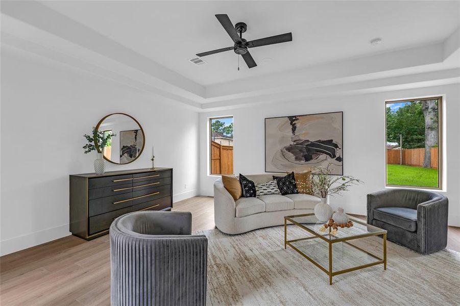 Spacious living room has views of the backyard on one side and views of the courtyard on the other side Spacious living room has views of the backyard on one side and views of the courtyard on the other side