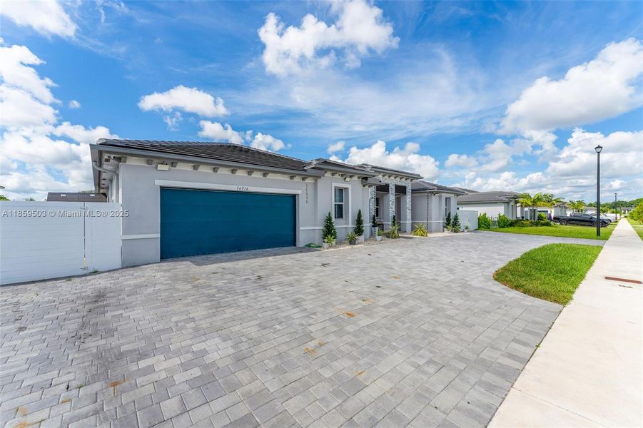 Front exterior of a new home in , Homestead, FL, highlighting curb appeal (Image 22). Front exterior of a new home in , Homestead, FL, highlighting curb appeal (Image 22).
