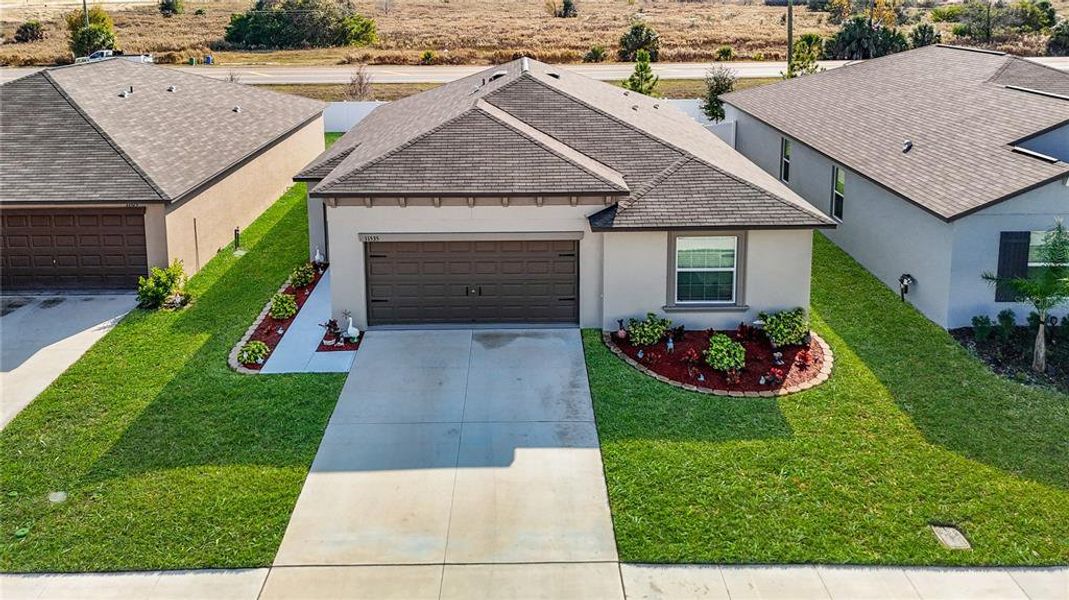 Front exterior of a new home in , Spring Hill, FL, highlighting curb appeal (Image 24).
