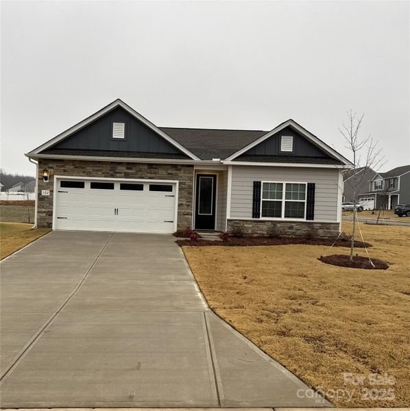 Front exterior of a new home in Colonial Crossing, Troutman, NC, highlighting curb appeal (Image 2). Front exterior of a new home in Colonial Crossing, Troutman, NC, highlighting curb appeal (Image 2).