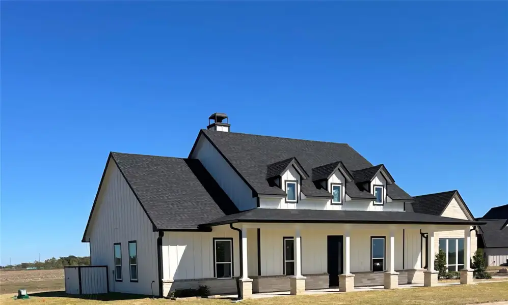 Front exterior of a new home in , Sealy, TX, highlighting curb appeal (Image 2). Front exterior of a new home in , Sealy, TX, highlighting curb appeal (Image 2).
