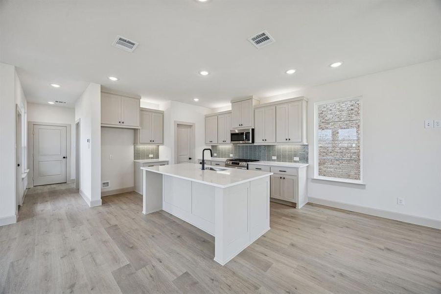 With ample storage and prep space, this dream kitchen offers plenty of space for you to create perfect family meals!