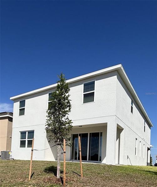 Exterior details and patio area of a home in Trinity Lakes, Groveland (Image 3).