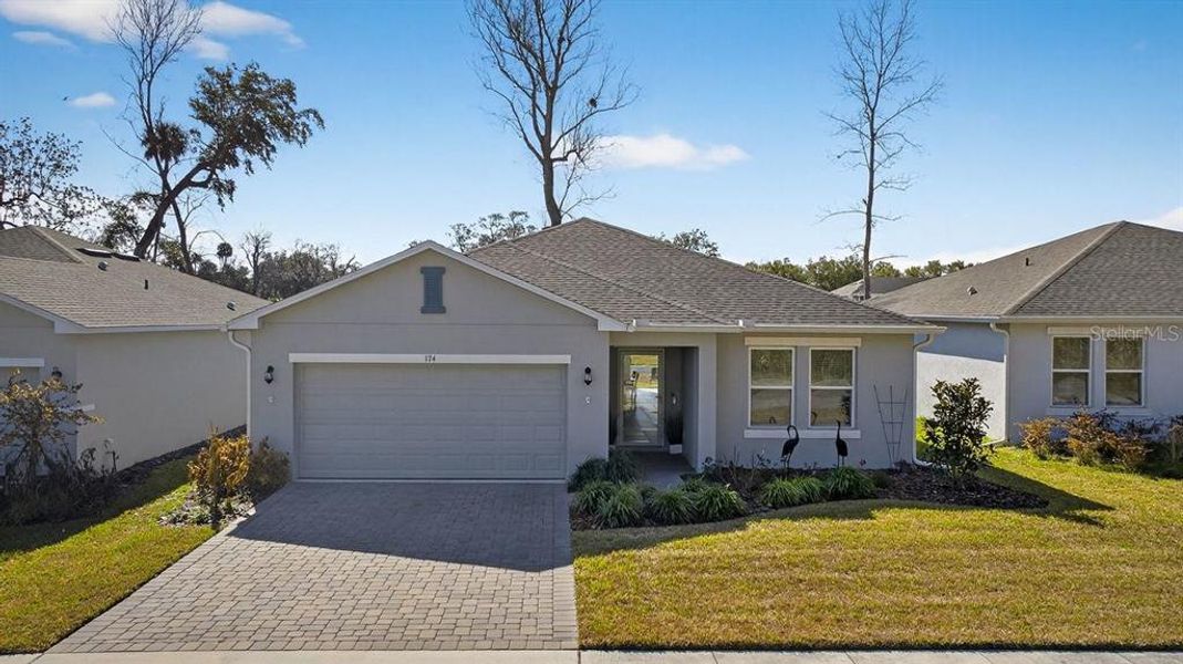 Front exterior of a new home in , Edgewater, FL, highlighting curb appeal (Image 1). Front exterior of a new home in , Edgewater, FL, highlighting curb appeal (Image 1).
