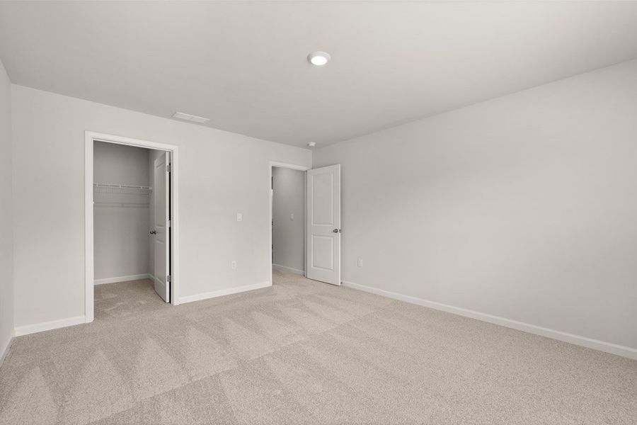 Representative unfurnished interior of a home built from the Mansfield by D.R. Horton in Southwind Village, Evans (Image 36).