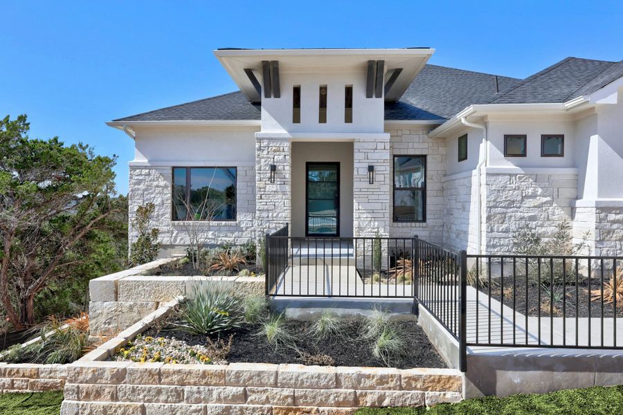 Front exterior of a new home in Riverstone, Georgetown, TX, highlighting curb appeal (Image 21).