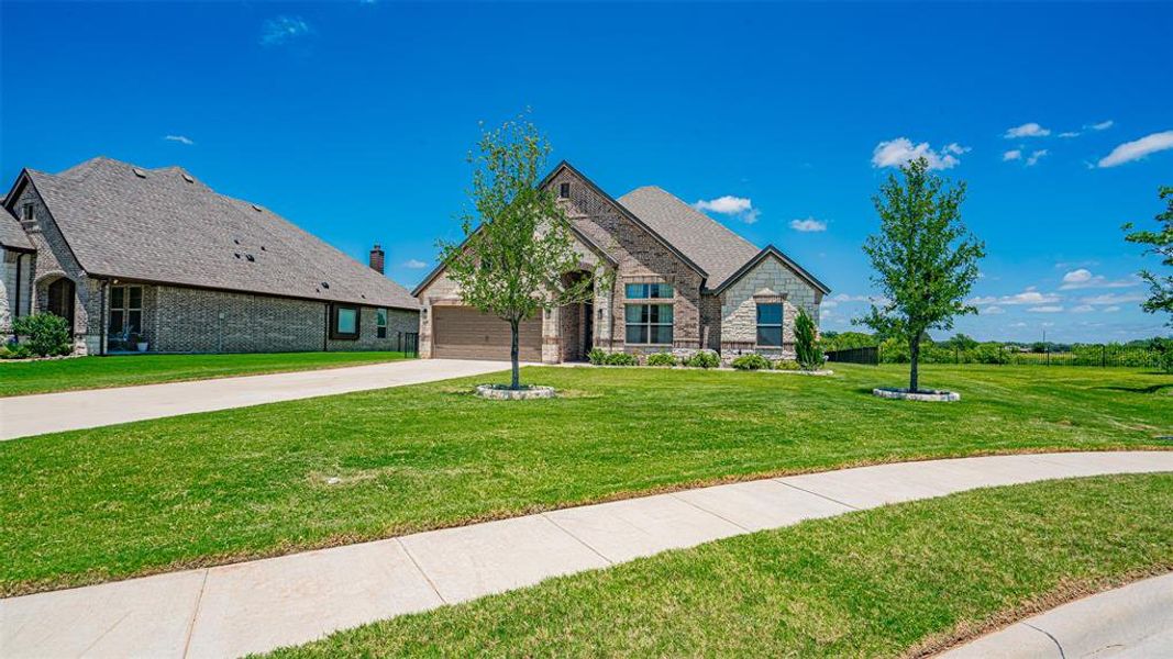 Brick and stone exterior with a two-car garage
