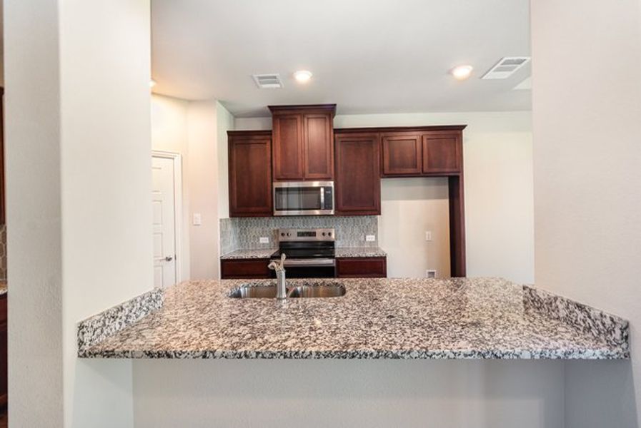 Furnished interior view inside a new home in Courts Of Bonnie Brae, Denton (Image 6).