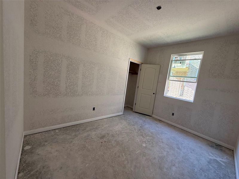 In-progress construction of a new home in The Cottages at La Cima, San Marcos, TX (Image 24).