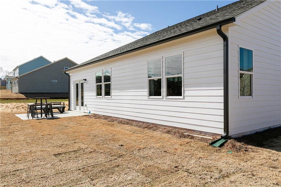 Exterior details and patio area of a home in Madison at Buice Lake, Acworth (Image 23).