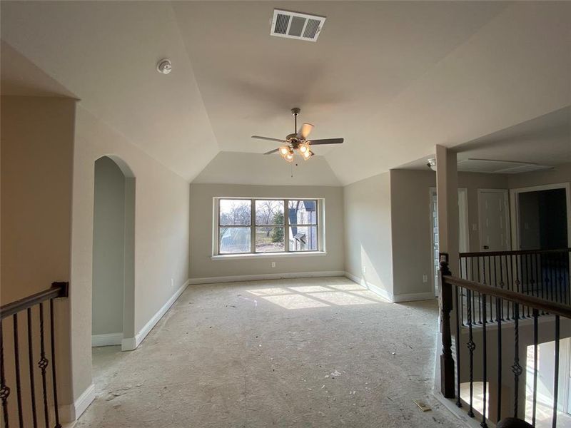 Huge gameroom with window seat & ceiling fan would be great for a pool table or second living area with TV & video games.