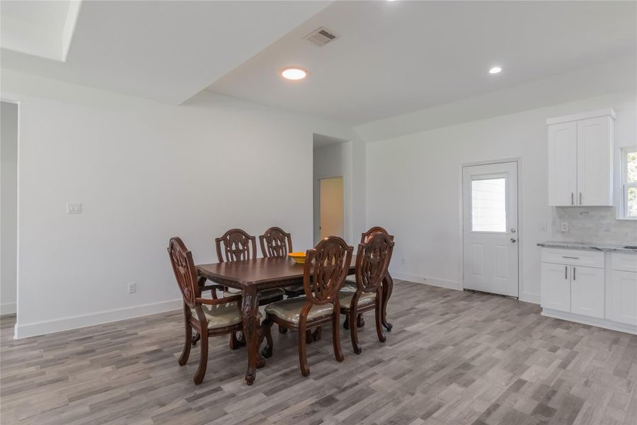 dining area looking towards the second master bedroom and the back door dining area looking towards the second master bedroom and the back door