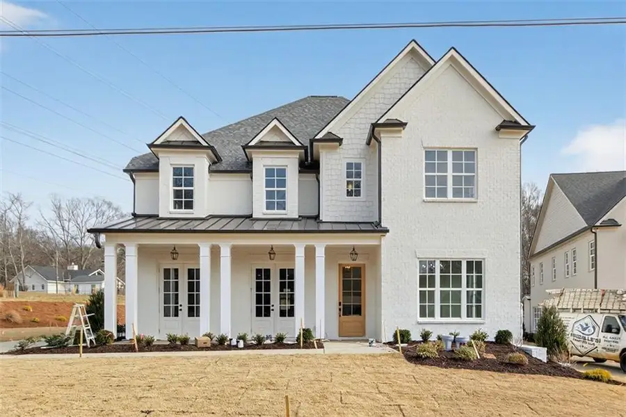 Front exterior of a new home in , Suwanee, GA, highlighting curb appeal (Image 1). Front exterior of a new home in , Suwanee, GA, highlighting curb appeal (Image 1).