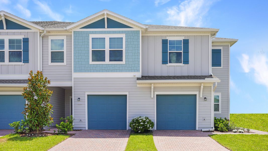Front exterior of a new home in Shearwater: Traditional Townhomes, St. Augustine, FL, highlighting curb appeal (Image 1). Front exterior of a new home in Shearwater: Traditional Townhomes, St. Augustine, FL, highlighting curb appeal (Image 1).