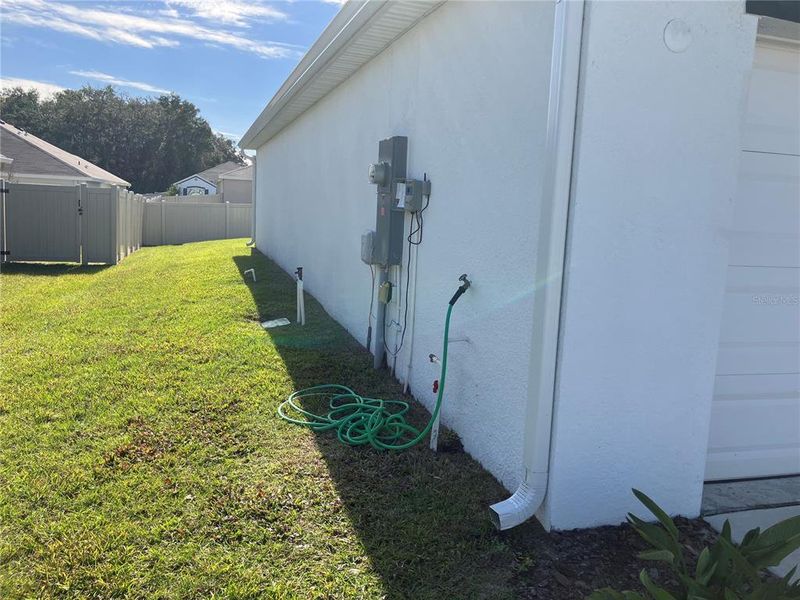 Exterior details and patio area of a home in Sunset Hills, Summerfield (Image 12).