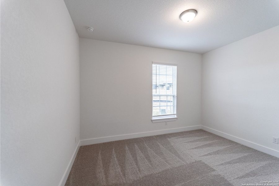 Spacious, unfurnished interior of a new home in The Woodlands at Medina Hills, Mico (Image 16).