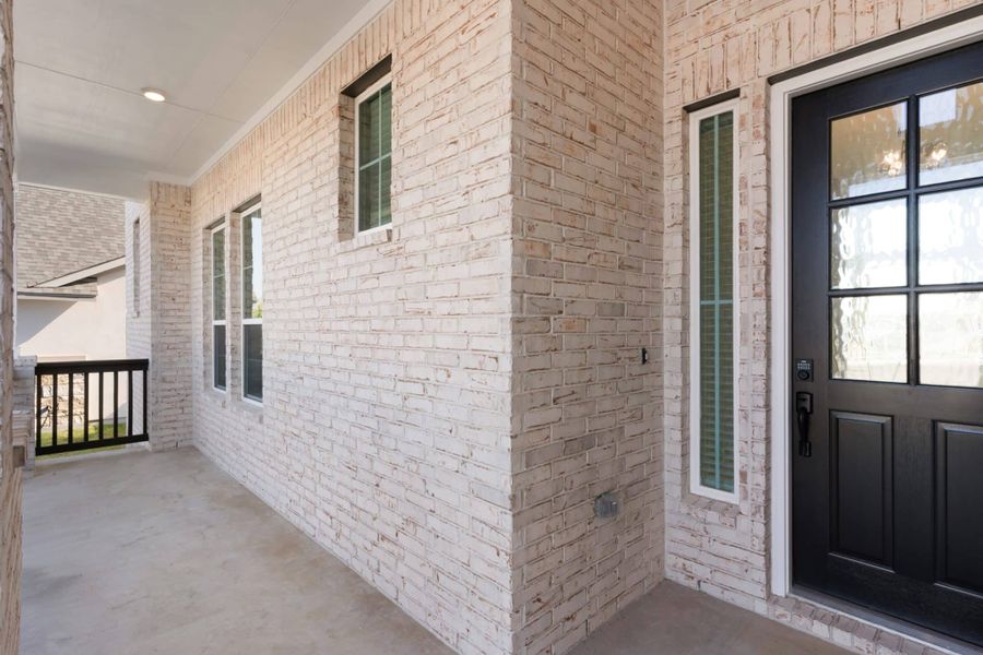 Exterior details and patio area of a home in Lariat, Liberty Hill (Image 4).
