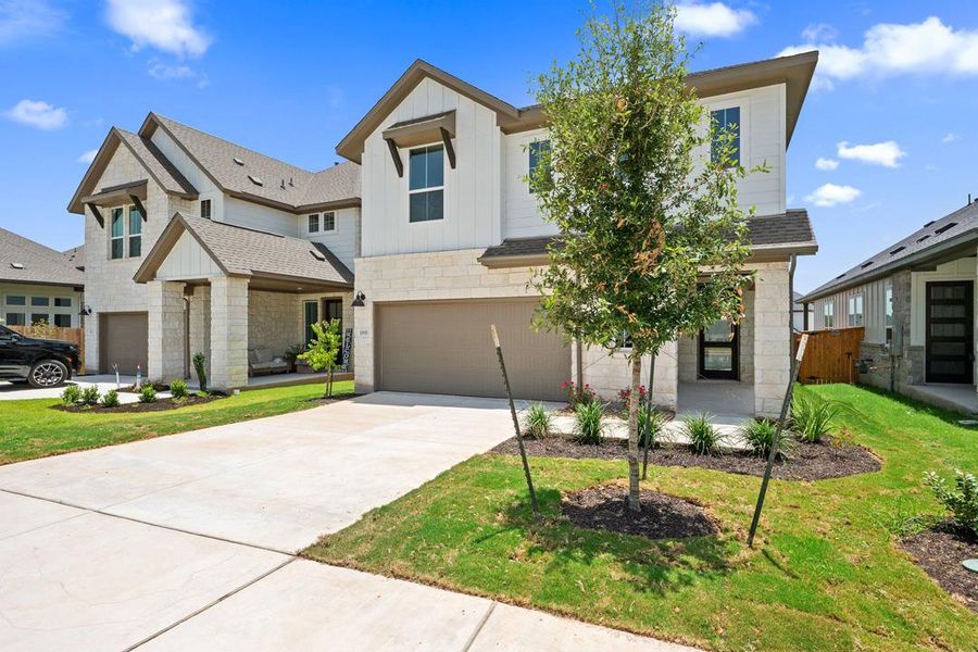 Front exterior of a new home in Heritage, Dripping Springs, TX, highlighting curb appeal (Image 21). Front exterior of a new home in Heritage, Dripping Springs, TX, highlighting curb appeal (Image 21).