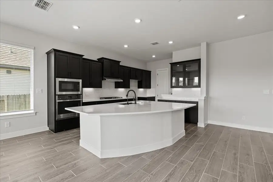 Furnished interior view inside a new home in Village at Three Oaks, Seguin (Image 11).