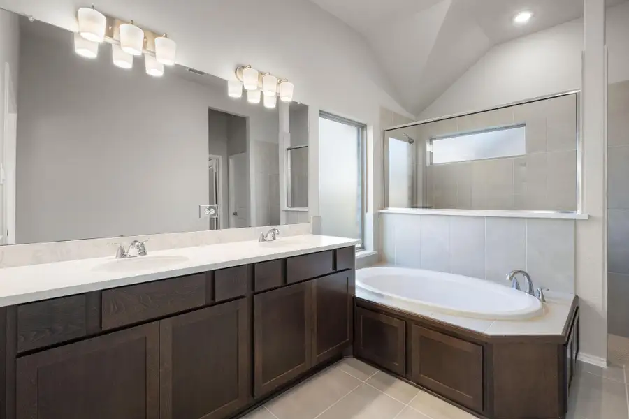 Furnished interior view inside a new home in Dunham Pointe 50', Cypress (Image 10).