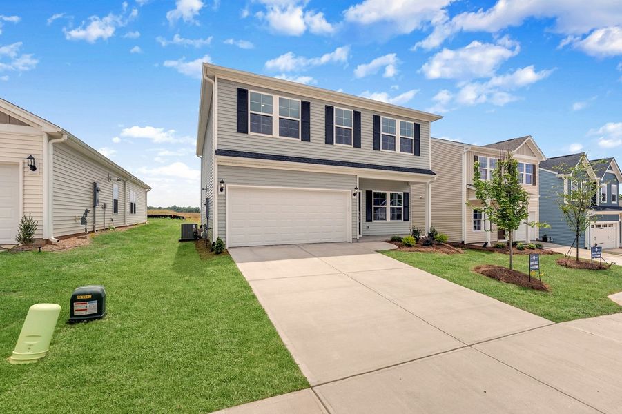 Front exterior of a new home in Mayfair Village, Spartanburg, SC, highlighting curb appeal (Image 2). Front exterior of a new home in Mayfair Village, Spartanburg, SC, highlighting curb appeal (Image 2).