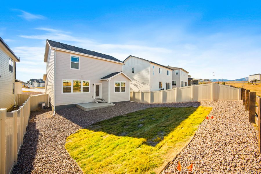 Exterior details and patio area of a home in Trails at Aspen Ridge-3, Colorado Springs (Image 4). Exterior details and patio area of a home in Trails at Aspen Ridge-3, Colorado Springs (Image 4).