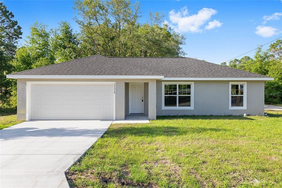 Front exterior of a new home in , Ocklawaha, FL, highlighting curb appeal (Image 1). Front exterior of a new home in , Ocklawaha, FL, highlighting curb appeal (Image 1).