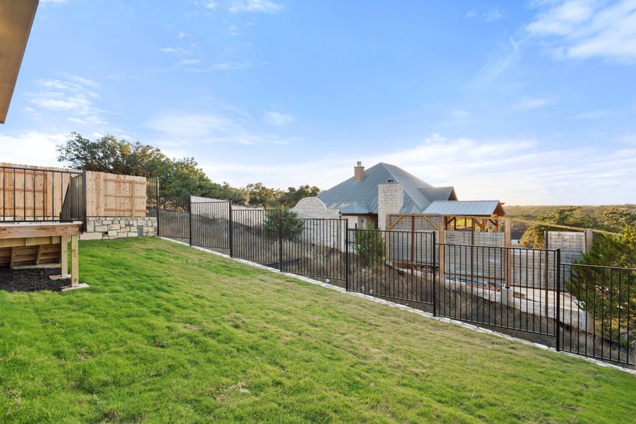 Exterior details and patio area of a home in Lariat, Liberty Hill (Image 31).