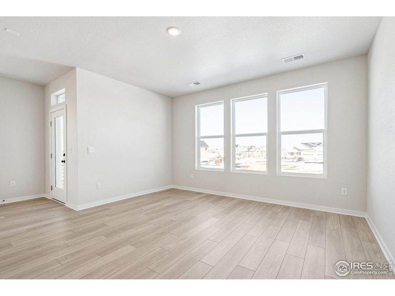 Spacious, unfurnished interior of a new home in Kinston Mainstreet Townhomes, Loveland (Image 32).