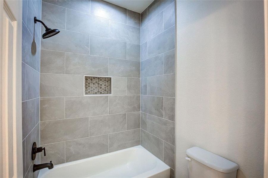 Full bathroom featuring shower / washtub combination Full bathroom featuring shower / washtub combination
