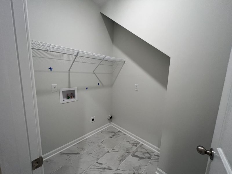 NOT THE ACTUAL HOME*
Stock photos

Laundry room with ceramic tile flooring.
