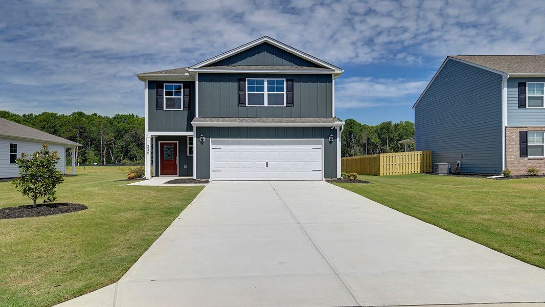 Front exterior of a new home in Sease's Pond, Gilbert, SC, highlighting curb appeal (Image 17). Front exterior of a new home in Sease's Pond, Gilbert, SC, highlighting curb appeal (Image 17).