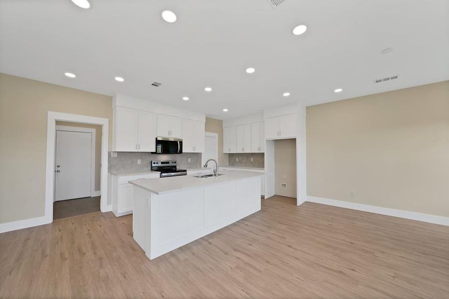 Furnished interior view inside a new home in , The Colony (Image 5).