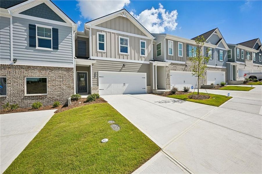 Front exterior of a new home in , Lithonia, GA, highlighting curb appeal (Image 27).