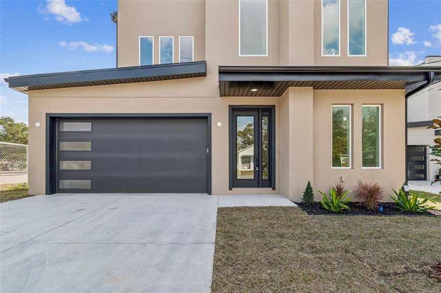 Front exterior of a new home in , Tampa, FL, highlighting curb appeal (Image 34).
