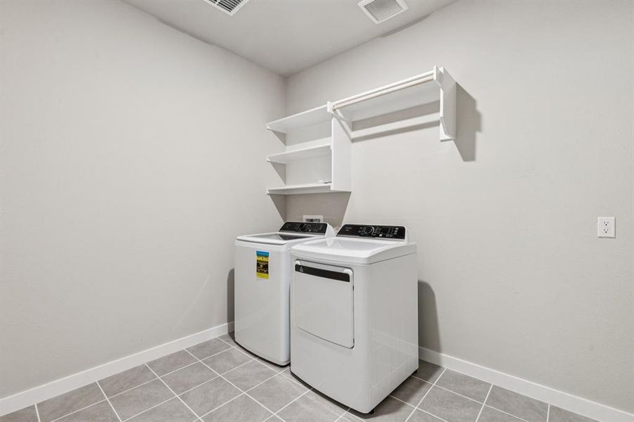 Utility Room in the Heisman home plan by Trophy Signature Homes – REPRESENTATIVE PHOTO Utility Room in the Heisman home plan by Trophy Signature Homes – REPRESENTATIVE PHOTO