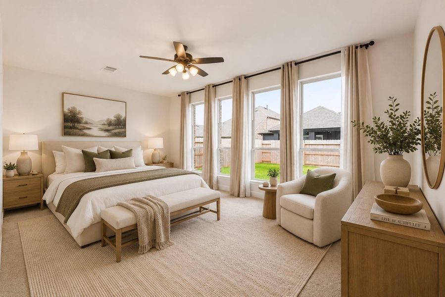 Privately situated, the serene primary suite offers a peaceful retreat filled with natural light, creating a bright, open, and airy atmosphere. *VIRTUALLY STAGED