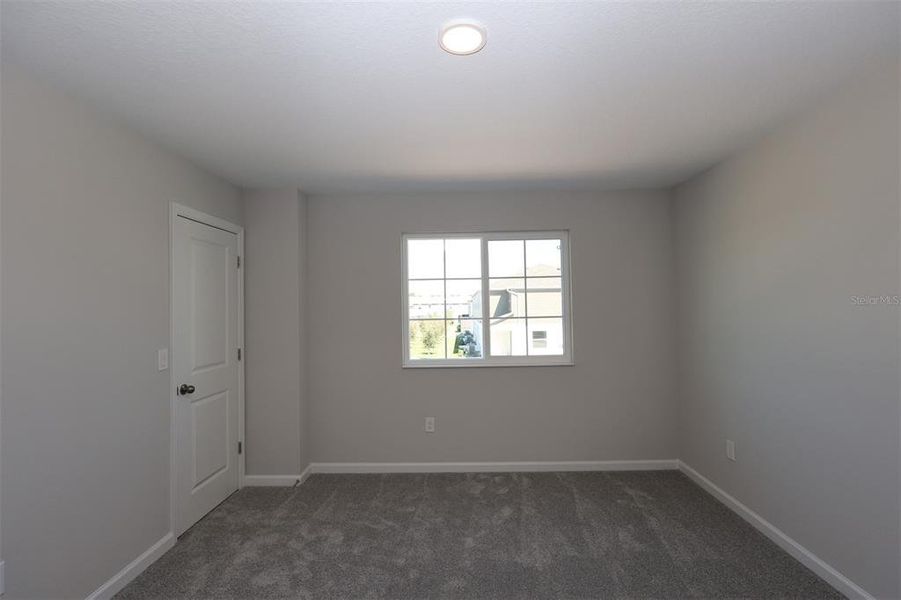 Spacious, unfurnished interior of a new home in Tyson Ranch, Orlando (Image 18).